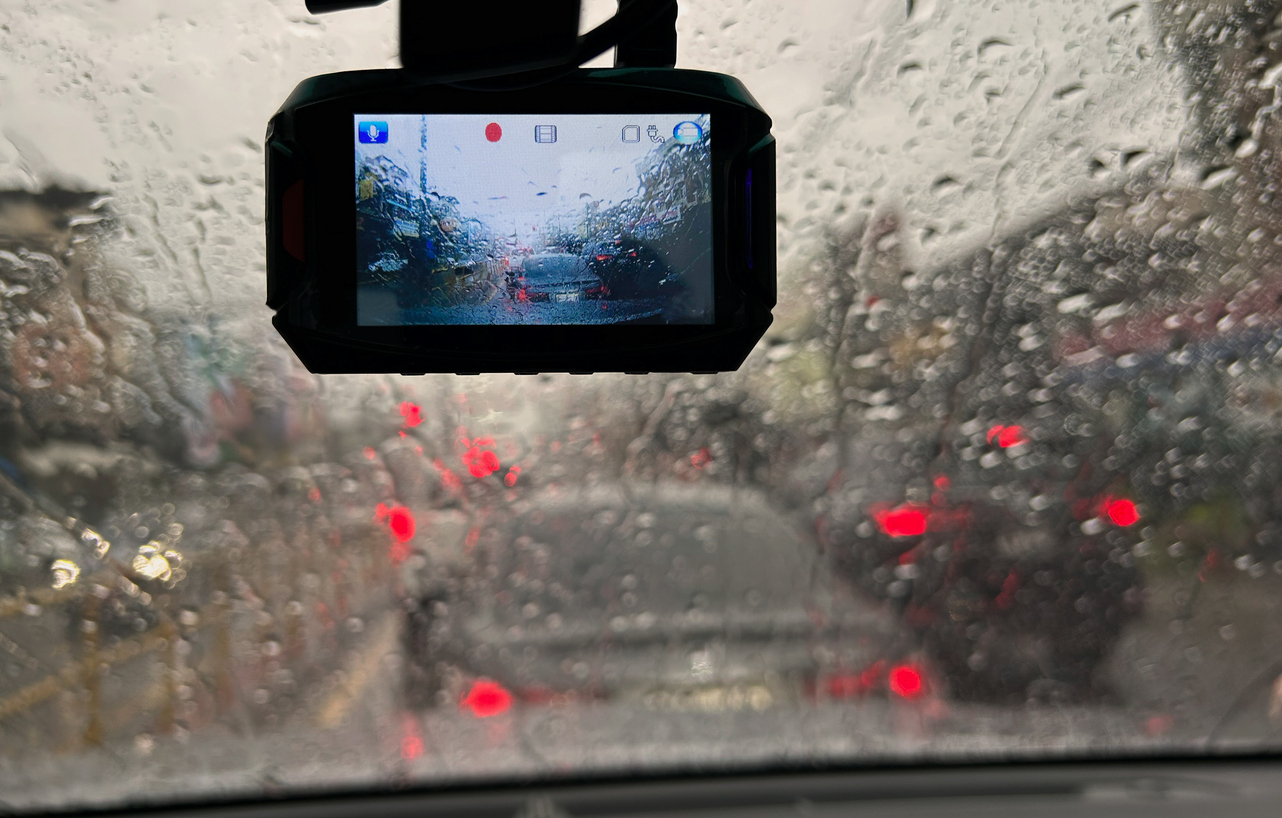 Raindrops on windshield captured by Ai-enabled dash camera footage.