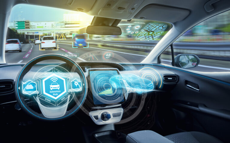 Empty cockpit of a driverless car with digital speedometer on virtual screen.