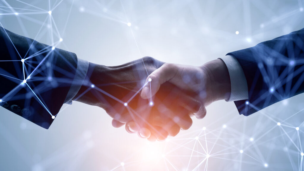 Handshake with virtual lines on the background.