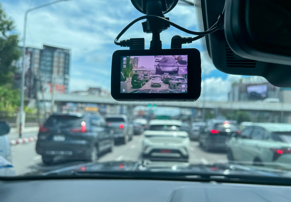 Front dashcam capturing road traffic.