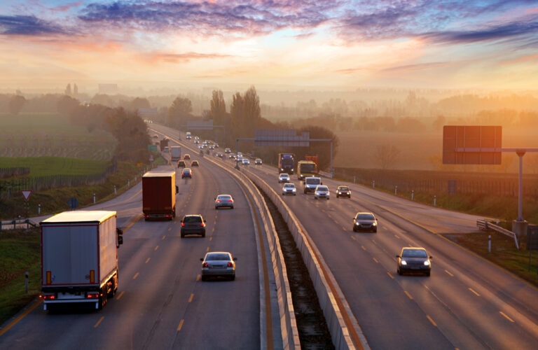 Google Street View: Top view of various vehicles driving through a highway.