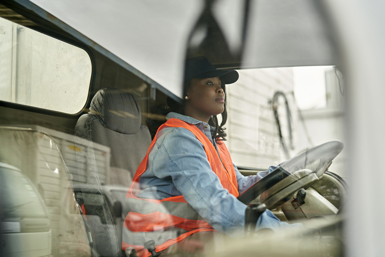Mobile sensor network - an African-American female driver inside her truck.