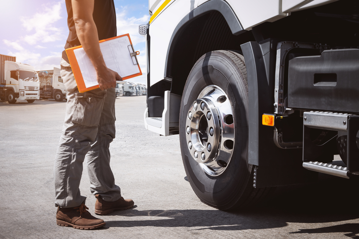 Mobile sensor network - A staff member inspecting a truck’s capacity to travel.