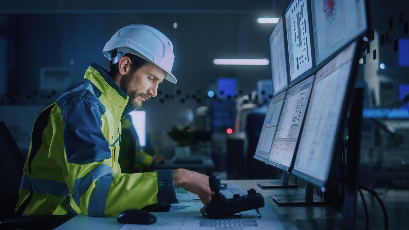 FHWA retroreflectivity compliance - an engineer inspecting the site with the help of AI on his computer in the office.