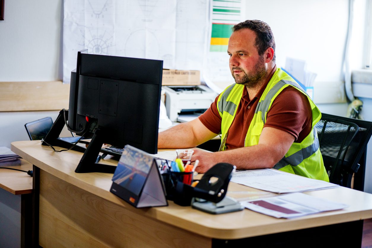 Safer roads for cyclists and motorists - a picture of an engineer monitoring heavy traffic using his computer.